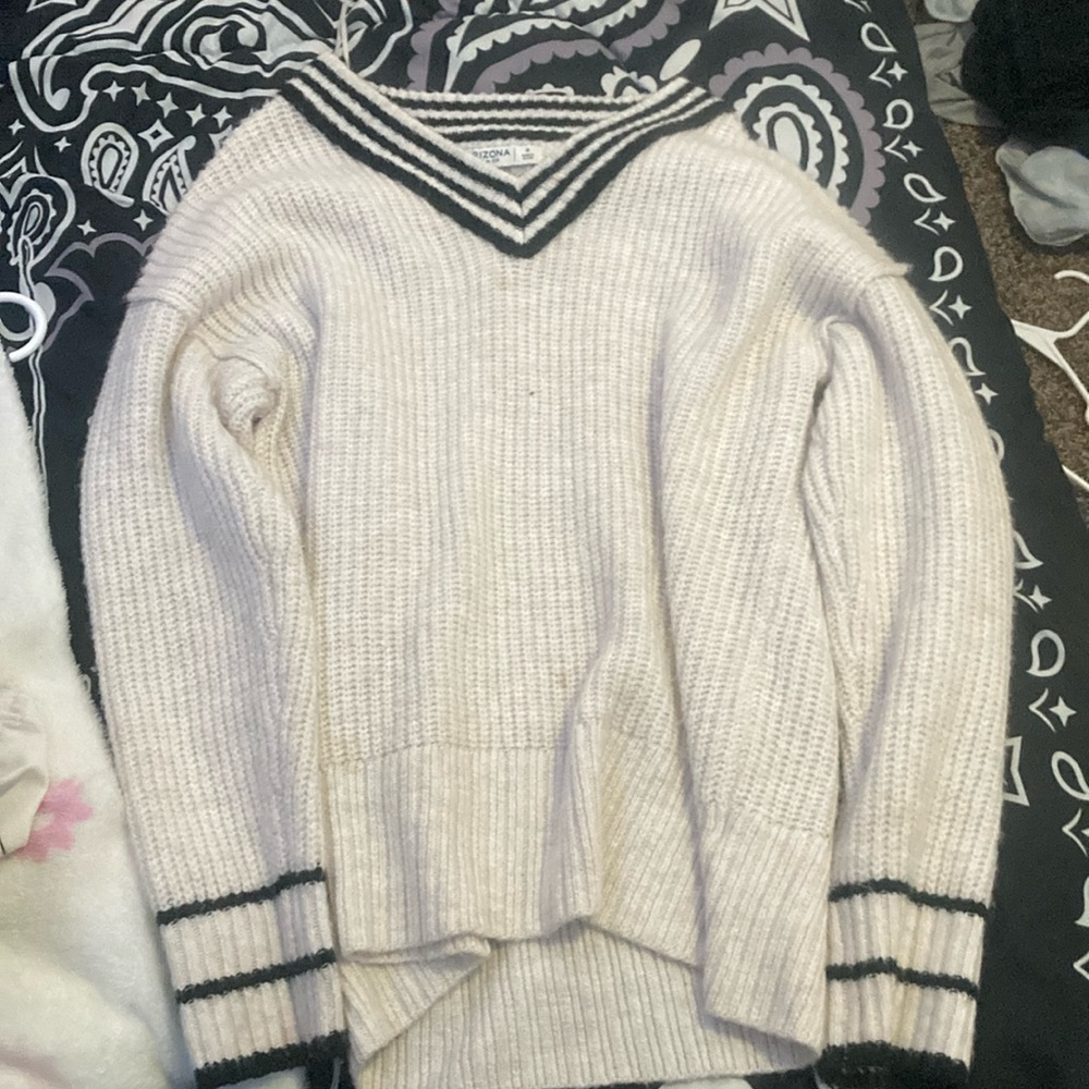 cable-knit black and white sweater